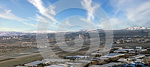 Panoramic view Cities of Reno and Sparks Nevada. during the winter with hotels, casinos and an airport. photo