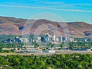 City  of Reno Nevada cityscape with hotels and casinos and mountains in the background. photo
