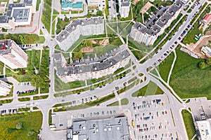 City residential area with shopping center and parking lot with cars. aerial view.