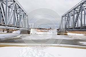 City Riga, Latvia. Old railway bridge and river in winter.Travel photo