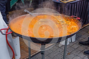 City Riga, Latvia. Street Restaurant food festival. The soup is cooked on open fire