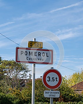 City road sign in Pomerol village, production of red Bordeaux wine, Merlot or Cabernet Sauvignon grapes on cru class vineyards in