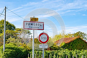 City road sign in Pomerol village, production of red Bordeaux wine, Merlot or Cabernet Sauvignon grapes on cru class vineyards in