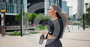 City, running and woman with water, drinking for health and wellness for outdoor exercise on break. Fitness, relax and