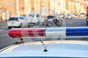 City safety. Police car on duty in urban street