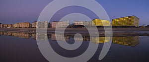 City of San Sebastian reflected in the water of the beach