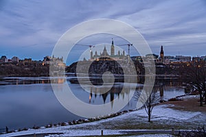 City scape at dusk with a city and a river