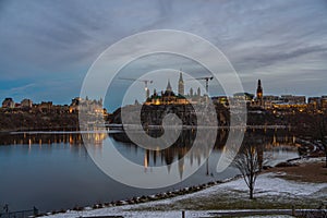 City scape at dusk with a city and a river