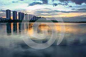 City scape at night with reflection on lake. Thailand. sunset wi