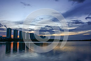 City scape at night with reflection on lake. Thailand. sunset wi