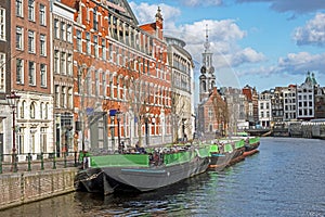 City scenic from Amsterdam with the Munt tower in the Netherlands photo