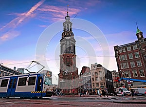 City scenic from Amsterdam in the Netherlands with the Munt tower photo