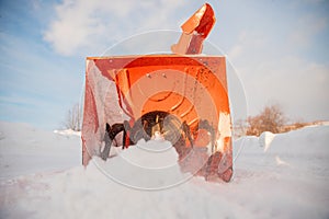 City service cleaning snow winter with thrower blower machine after snowstorm yard