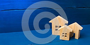 City, settlement. Minimalism. for presentations. real estate market. Three houses on a blue background. Buying and selling