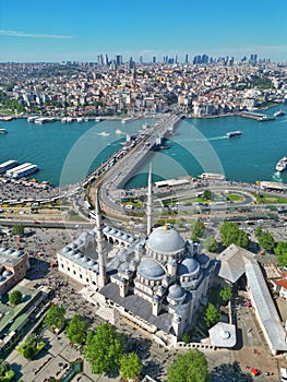 a city with several buildings and an airplane flying above it