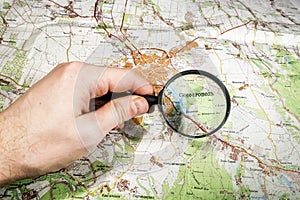 The city of Simferopol on map of Crimea through a magnifying glass, Ukraine