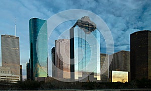 City skyline against cloudy sky