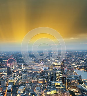 City skyline along river Thames at night, aerial view - London -