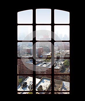 City skyline from an apartment or office window on a bright sunny day. View from inside an empty dark penthouse or hotel