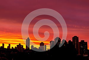 City Skyline With Beautiful Vivid Colorful Skies At Sunset Sunrise Silhouette