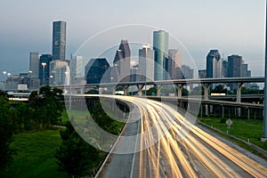 City skyline at dusk with traffic