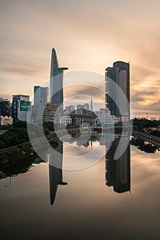 City Skyline of Ho Chi Minh cityscape at Sunset, Bitexco Tower in the financial area riverside. Saigon, Vietnam, vertical