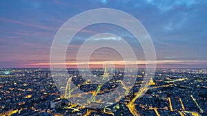 The city skyline at night. Paris, France. Taken from the tour Montparnasse day to night timelapse