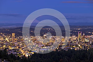 City skyline in Portland Oregon. Cityscape buildings downtown Portland Oregon at dusk during blue hour seen from Pittoack Mansion