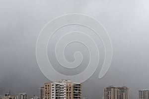 city skyline in rainy and foggy day