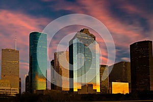 City skyline reflecting sunset