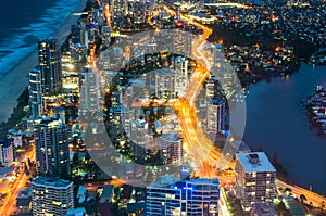 City skyscrapers and traffic at night, aerial, long exposure