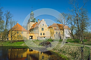 City Straupe, Latvia. Old castle and pond. photo