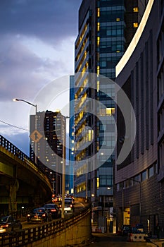 City street bridge merge lane with buildings in background portrait