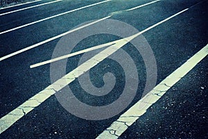 City street with crooked road lines geometric pattern abstract seamless highway background. Aged grungy urban roadway