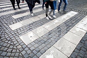 City street with a motion blurred crowd