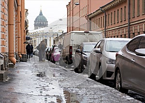 City street, Petersburg, people walking on sidewalk, cars parked