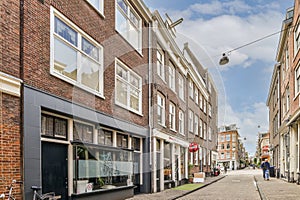 a city street with a red brick building with windows