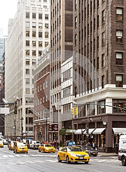 City street scene with a yellow taxi cabs