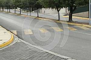 City street with striped concrete speed bump