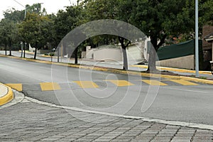 City street with striped concrete speed bump