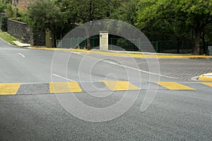 City street with striped concrete speed bump