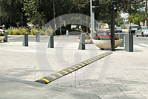 City street with striped plastic speed bump