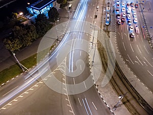 City streets aerial look down, cars on night road