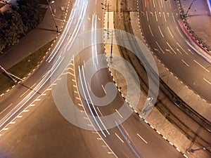 City streets aerial look down, cars on night road