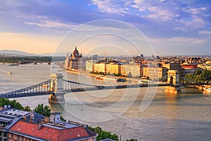 City summer landscape at sunset - top view of the historical center of Budapest with the Szechenyi Chain Bridge over the Danube