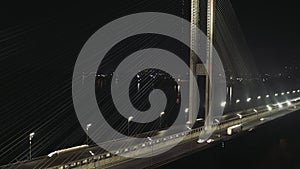 City traffic on the modern bridge in Kyiv the fog at the night aerial view