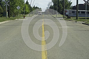 City transport bus approaching an intersection on the road