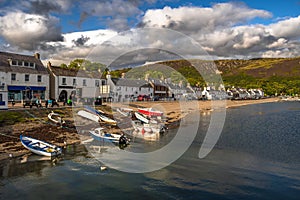 City Of Ullapool With Old Fishing Boat At Loch Broom In Scotland photo