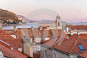 City view of Dubrovnik, Croatia, buildings with orange roofs in old town during sunset