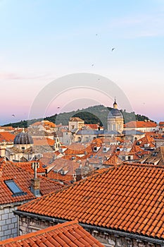 City view of Dubrovnik, Croatia, buildings with orange roofs in old town during sunset